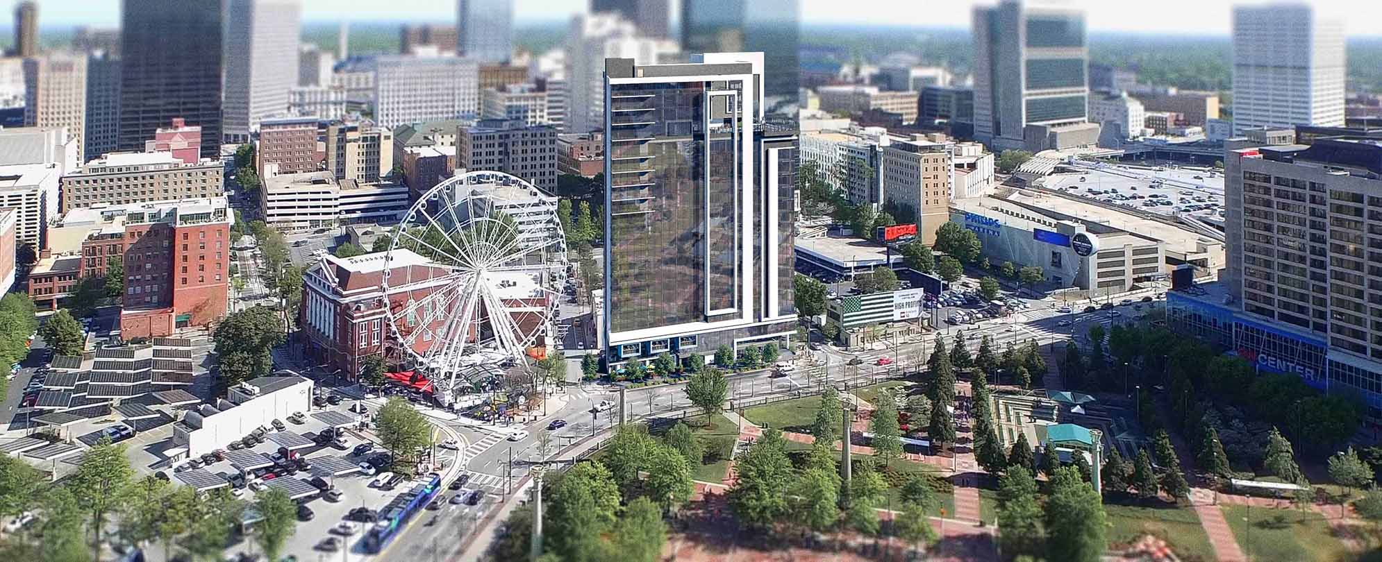 An aerial view of Downtown Atlanta with a ferris wheel near Club