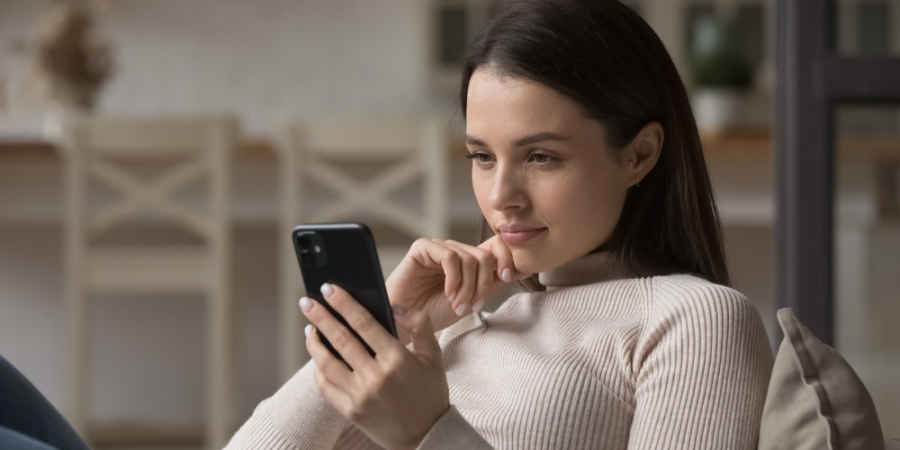 woman looking at smartphone